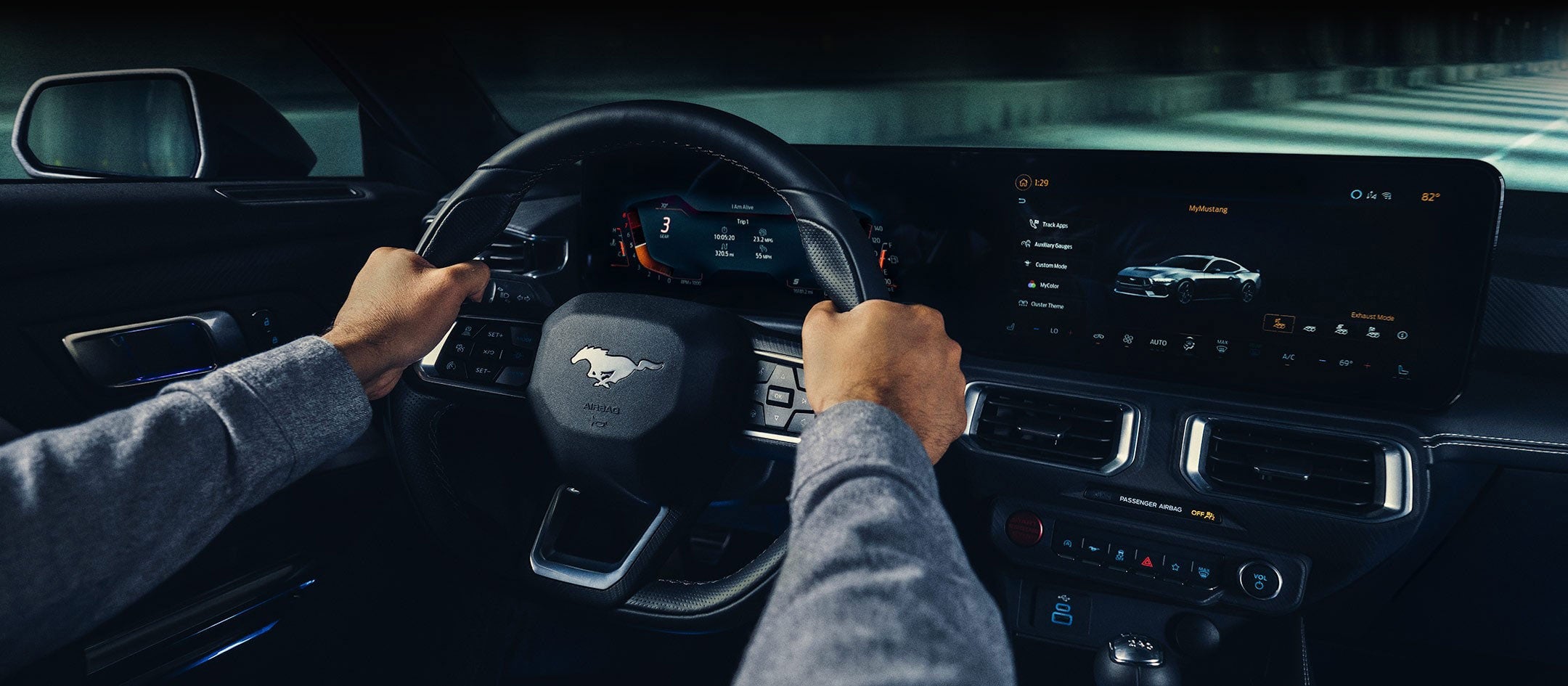 A 2024 Ford Mustang® model interior with a person driving | Lundgren Ford in Eveleth MN