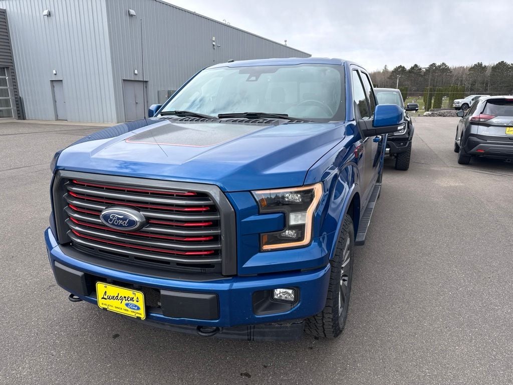 2017 Ford F-150 Lariat in Lightning Blue — front three-quarter view