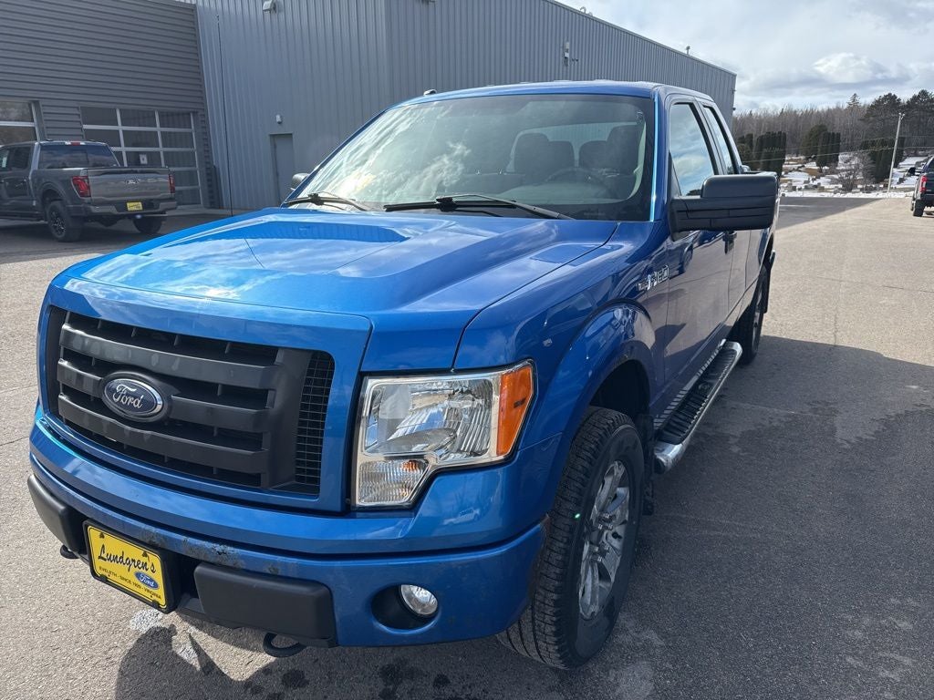 2012 Ford F-150 STX in Blue Flame Metallic — front three-quarter view