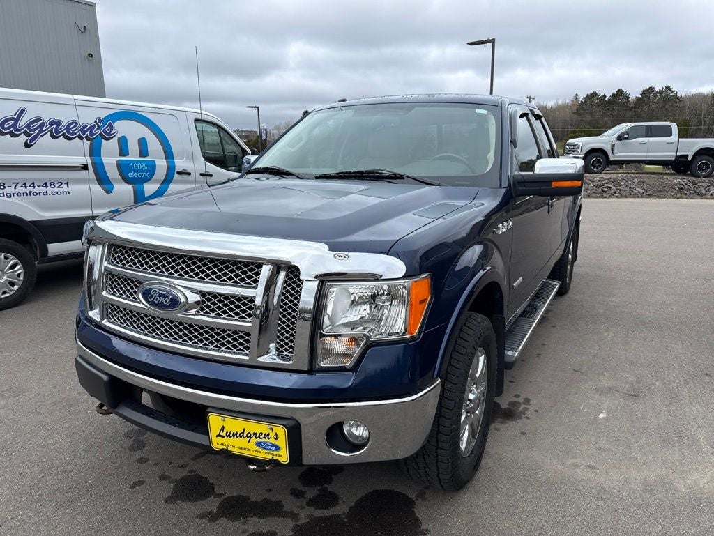 2012 Ford F-150 Lariat in Dark Blue Pearl Metallic — front three-quarter view